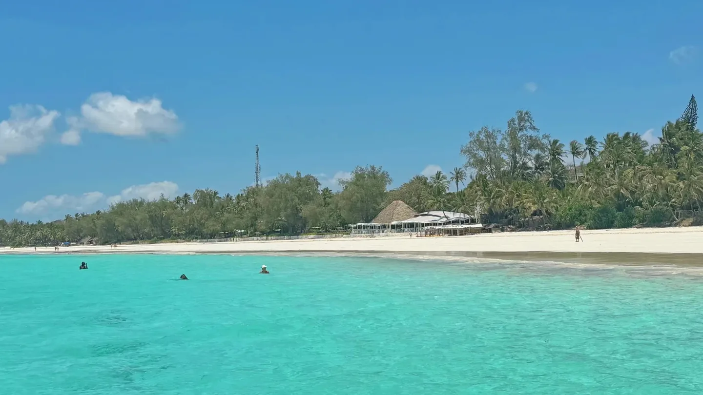Quiet white-sand shoreline and turquoise water at Diani Beach, Kenya