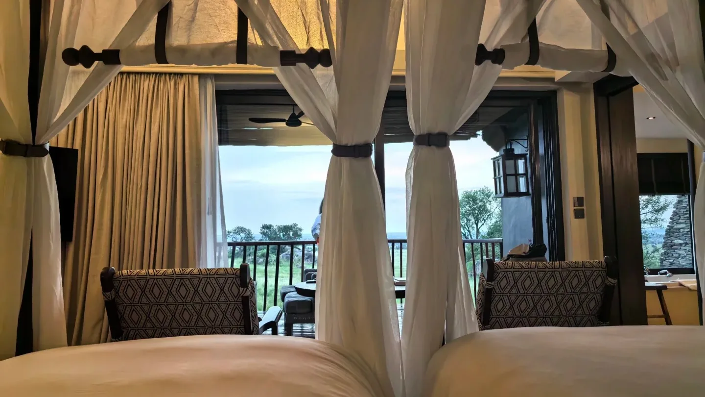 Four-poster bed in a luxury safari lodge room in Kenya