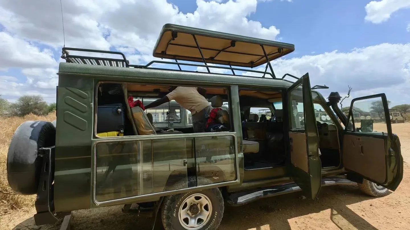Open-sided safari vehicle prepared for wildlife viewing in the Serengeti
