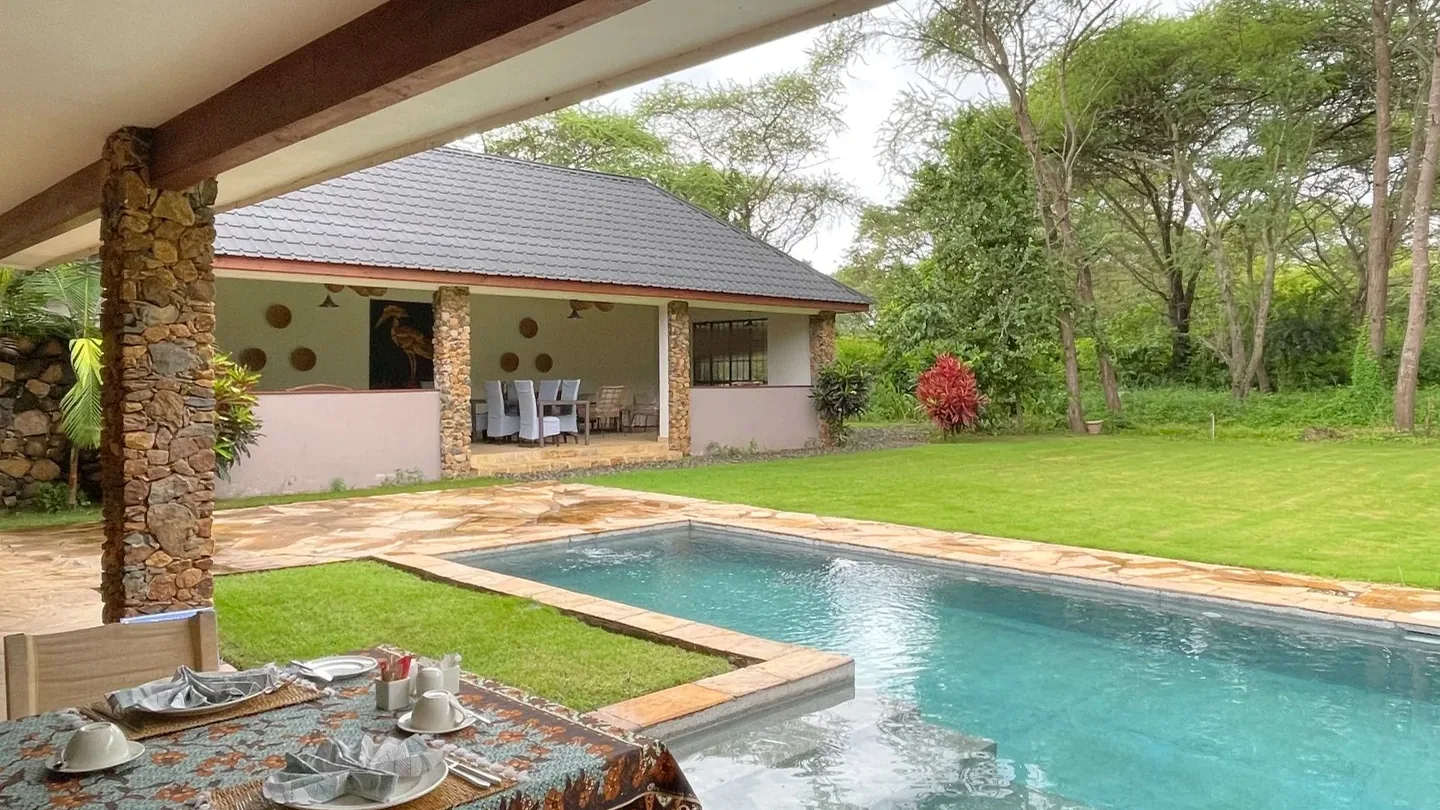 Pool and garden at a luxury safari lodge in Tanzania